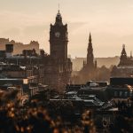 Edinburgh skyline with the Balmoral clock tower and Scott Monument at golden hour